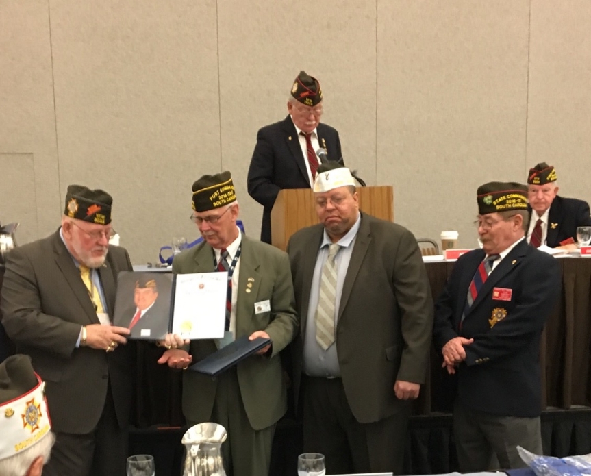 Commander Jim Taylor accepts the award for the Post's EMS Public Service nominee.  Pictured left to right are Keith Harman, National Senior Commander-in-Chief, Jim Taylor, Commander Post 12136, Issac Miller, District 5 Quartermaster, and Bill Havlin, Department of South Carolina Commander